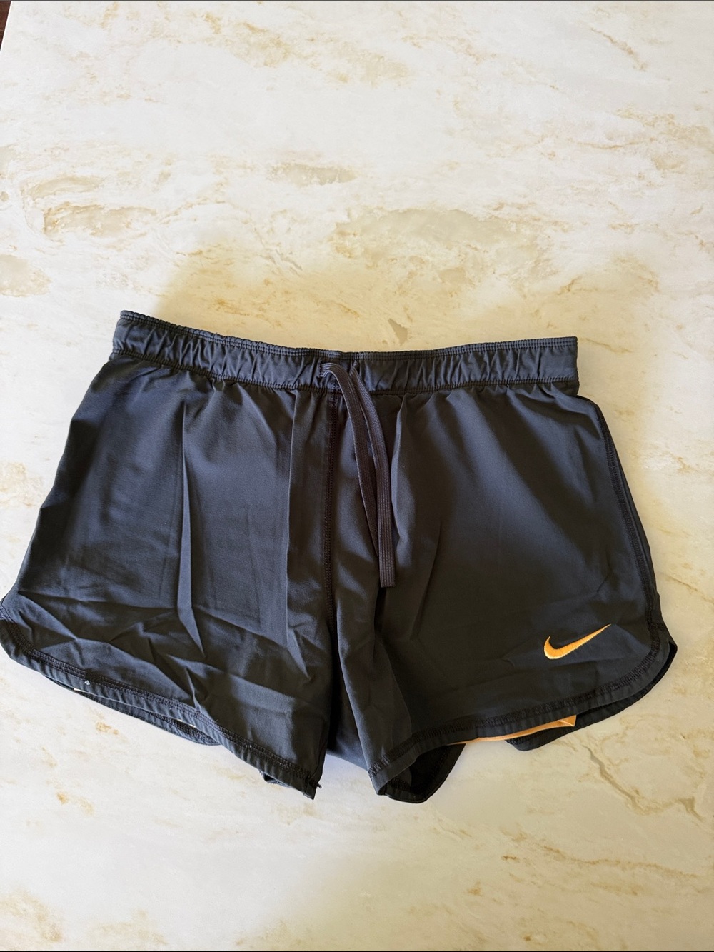 Nike Women’s Black Athletic Shorts with Orange Swoosh
